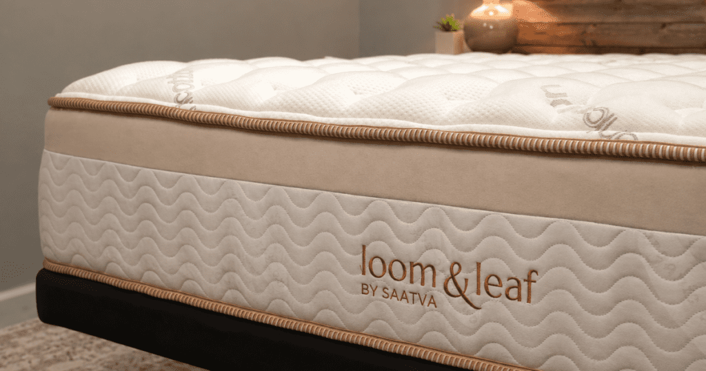 Close-up of the Saatva Loom and Leaf mattress gold trim and quilted organic cotton cover.